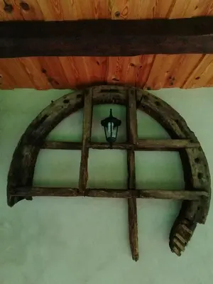 a wooden ceiling with a light in a room at Holiday house apartment Voukov mlin in Šmarje pri Jelšah