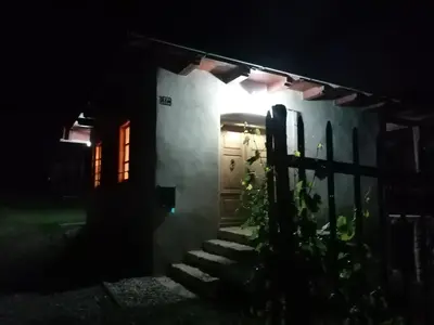 a door to a house at night at Holiday house apartment Voukov mlin in Šmarje pri Jelšah