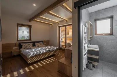 a bedroom with a bed and a window at Veldes B&B in Bled