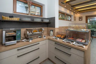 a kitchen with a counter with some food on it at Veldes B&B in Bled