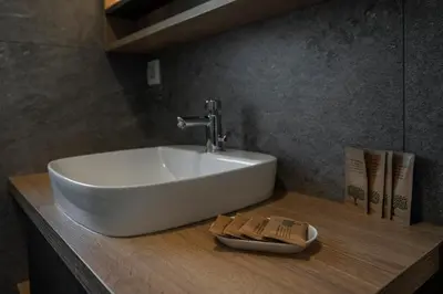 a white sink on a counter in a bathroom at Veldes B&B in Bled