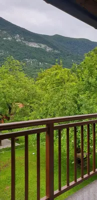 a balcony with a view of a field of grass at APARTMAJI VITEZ apartma 2 in Bovec