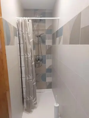 a bathroom with a shower with a shower curtain at APARTMAJI VITEZ apartma 2 in Bovec