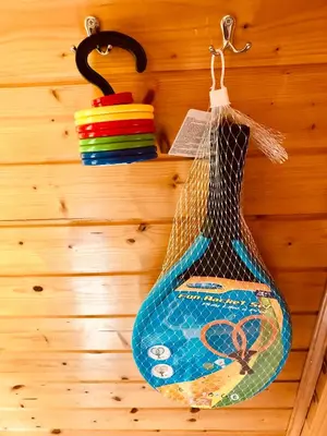 a bag hanging from a hook on a wooden wall at Holiday Cottage Krishtan in Podčetrtek