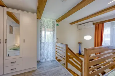 a room with a staircase and a window at Kolpa reka 