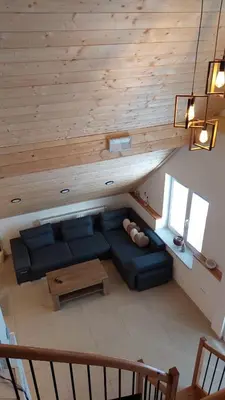 a living room with a couch and a table at Apartments Ela in Rateče