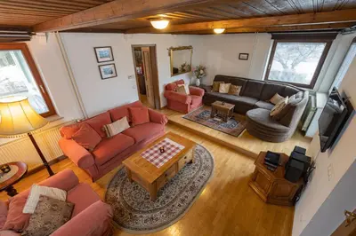 an overhead view of a living room with a couch and a table at The Green House in Mojstrana