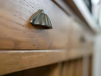 a metal door knob on a wooden drawer at The Green House in Mojstrana