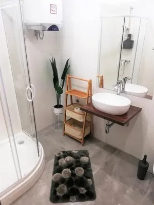 a bathroom with a sink and a tub and a shower at Apartment Leggero in Moravske Toplice