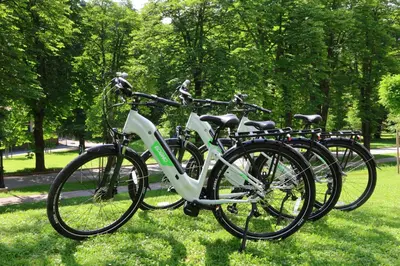 a group of bikes parked in a park at Boutique Hotel Dobrna - Terme Dobrna in Dobrna