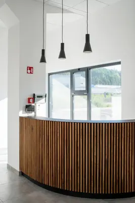 a wooden counter in a room with a window at Roko Garni Hotel in Brezovica