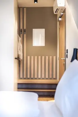 a view of a room with a door and a bedroom at Penzion Repanšek in Radomlje