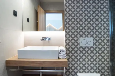 a bathroom with a sink and a mirror at Penzion Repanšek in Radomlje