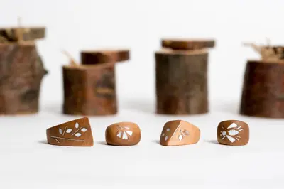 a group of wooden balls with designs on them at Apartmaji Rauter in Bohinj