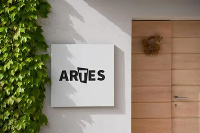 a sign on a wall with the wordaires on it at Villa Artes with Free Hot Tub & Sauna in Branik