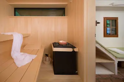 a sauna with a trash can in a room at Villa Artes with Free Hot Tub & Sauna in Branik