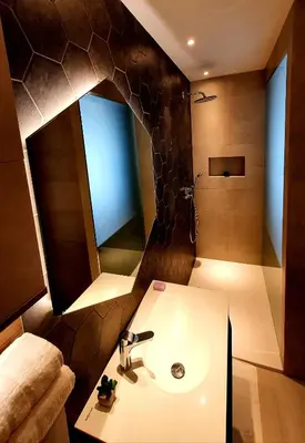 a bathroom with a sink and a mirror at Petkovšek Rooms and Apartments in Ljubljana