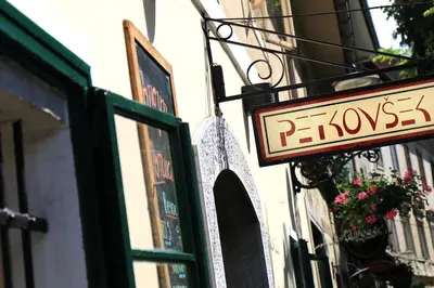 a sign for a pharmacy on the side of a building at Petkovšek Rooms and Apartments in Ljubljana
