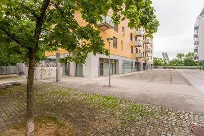 an empty street in front of a building at Apartma N'Poznam in Ljubljana