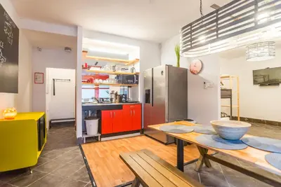 a kitchen with a table with a bowl on it at Apartma N'Poznam in Ljubljana