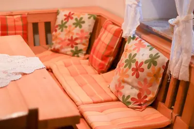 a toy train with pillows on a table at House Alpine Rose in Mojstrana