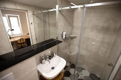 a bathroom with a sink and a shower at Becycle Sustainable stay and travel in Maribor