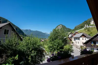 a view of a village with mountains in the background at Holiday house Zupanc in Bohinj