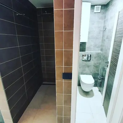 a bathroom with a toilet and a shower at Savna cimr in Mežica