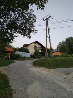an empty road in front of a house at Eko kmetija Gerbec in Grahovo
