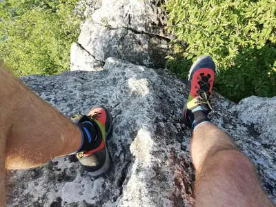 a man with his feet on top of a rock at House Donačka Gora in Rogatec