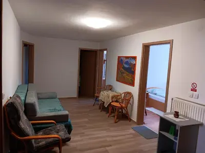 a living room with a couch and a table at turistična kmetija pr mark in Trebče