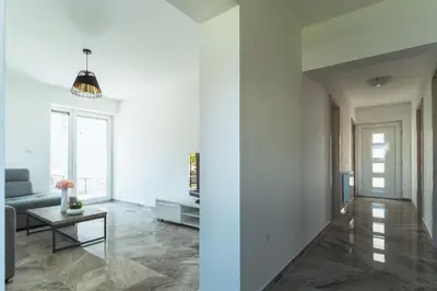 a living room with a couch and a table at Julian Manor apartments in Bovec