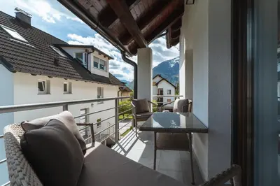 a balcony with a table and a view of a mountain at Julian Manor apartments in Bovec