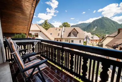 a balcony with a chair and a view of mountains at Vila K29 in Bovec