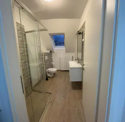 a bathroom with a shower and a toilet and a sink at Vila K29 in Bovec