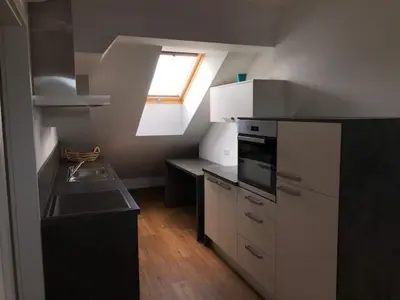 a kitchen with a sink and a window in it at Apartma na hüti in Radenci