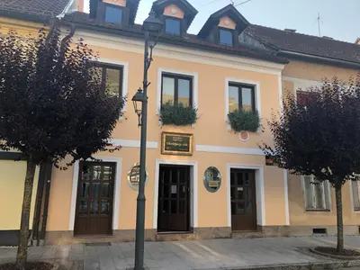a building with two doors and a street light at Apartma pri Gradu in Brežice