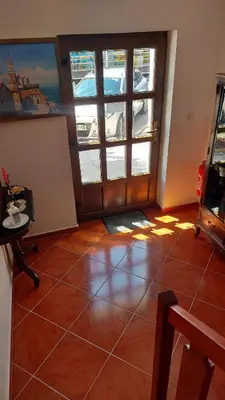 a room with a door and a tiled floor at Apartma pri Gradu in Brežice