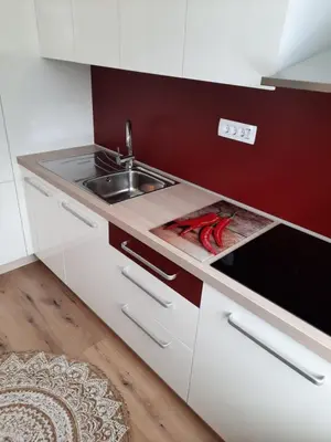 a kitchen with a sink and a counter top at Apartma Rožle in Mojstrana