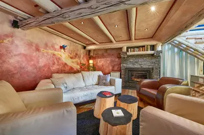 a living room with a couch and a fireplace at Pikol Lake Village Wine Estate in Nova Gorica
