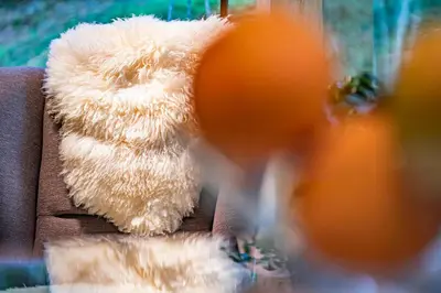 a stuffed teddy bear sitting on a couch at Pikol Lake Village Wine Estate in Nova Gorica