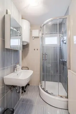 a bathroom with a sink and a shower at Apartment Mojca in Bovec