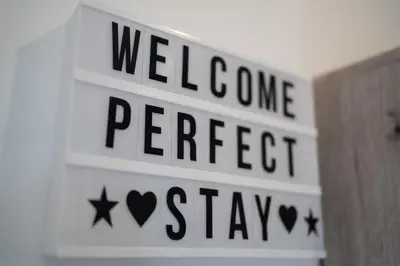 a street sign with the words wellcome perrier stay at Perfect stay in Šentilj