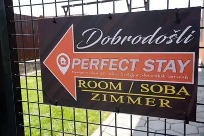 a sign on a fence that reads doren soda zimbabwe at Perfect stay in Šentilj