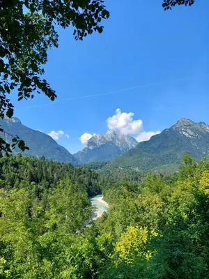 a view of a river in a valley with mountains at Počitniška hiša Nad Sočo in Bovec