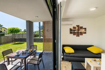 a living room with a couch and a table at Apartmaji BANONIA in Veržej