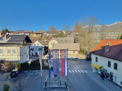 an aerial view of a city with buildings and a street at Lakefront Bled - Rooms & Apartments in Bled