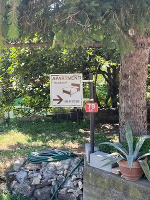 a sign for a park in front of a tree at Apartmaji Klabjan - Kaki in Osp
