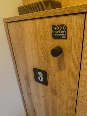 a wooden door with the number three on it at Rooms Minka in Kamna Gorica