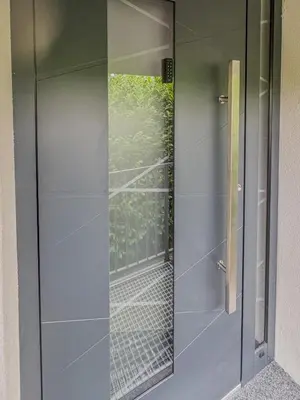 a glass door with a view of a balcony at Rooms Minka in Kamna Gorica
